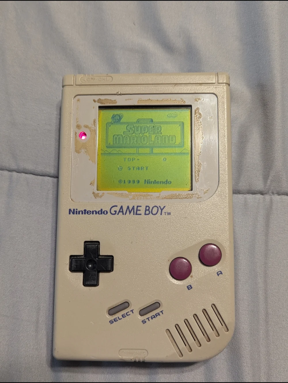 Nintendo Game Boy Portable in Cream with Purple Buttons